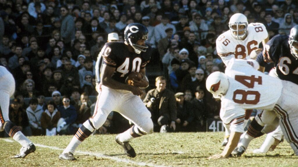 Nov 14,1965: Chicago, IL, USA FILE PHOTO; Chicago Bears running back Gale Sayers (40) carries the ball against the St. Louis Cardinals at Wrigley Field.
