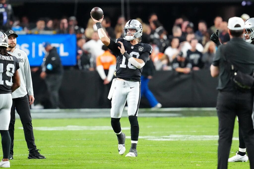 Nov 24, 2024; Paradise, Nevada, USA; Las Vegas Raiders quarterback Desmond Ridder (10) warms up after replacing Las Vegas Raiders quarterback Gardner Minshew (15) in a game against the Denver Broncos during the fourth quarter at Allegiant Stadium.