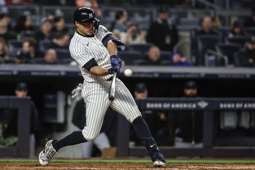 Apr 10, 2024; Bronx, New York, USA; New York Yankees designated hitter Giancarlo Stanton (27) hits a solo home run in the sixth inning against the Miami Marlins at Yankee Stadium.