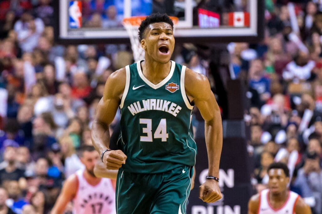 Jan 1, 2018; Toronto, Ontario, CAN; Milwaukee Bucks forward Giannis Antetokounmpo (34) reacts after scoring against the Toronto Raptors during the second half at Air Canada Centre.