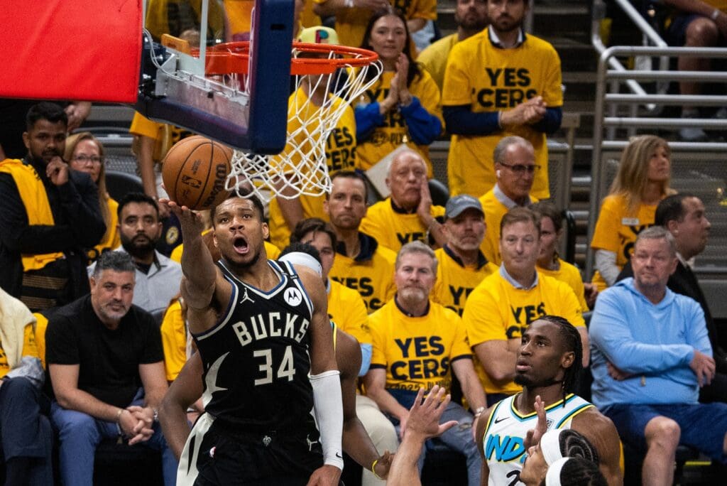 Apr 29, 2025; Indianapolis, Indiana, USA; Milwaukee Bucks forward Giannis Antetokounmpo (34) shoots the ball while Indiana Pacers guard Andrew Nembhard (2) defends during game five of the first round for the 2024 NBA Playoffs at Gainbridge Fieldhouse.