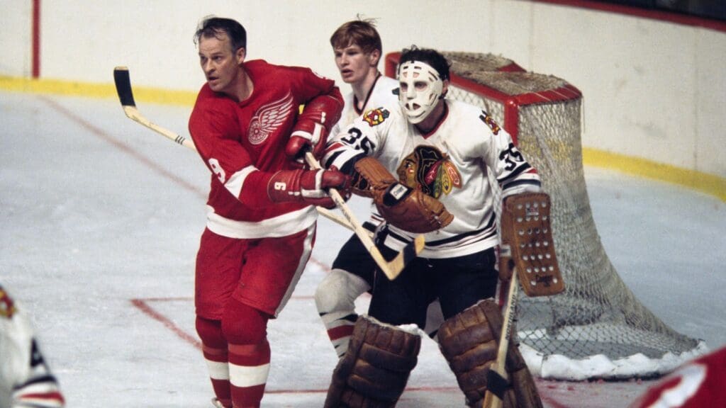 1970; Detroit, MI, USA; FILE PHOTO; Chicago Blackhawks goalie Tony Esposito (35) and defender Keith Magnuson (3) in action against Detroit Red Wings right wing Gordie Howe (9) during the 1970 season.