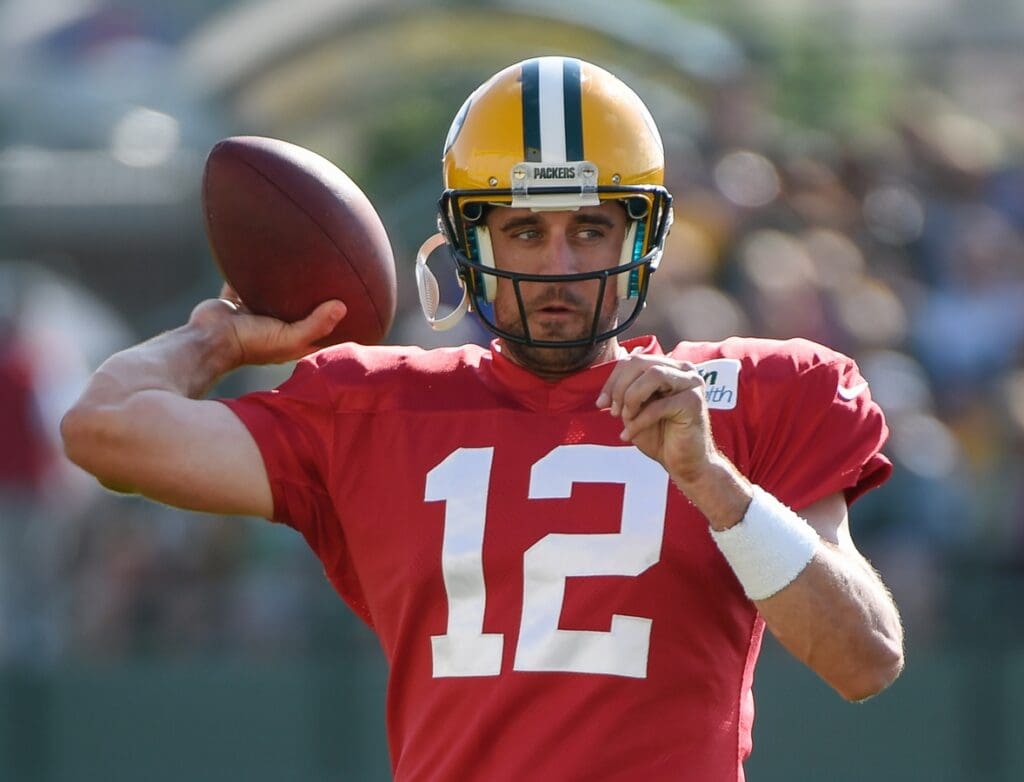 Jul 30, 2014; Green Bay, WI, USA; Green Bay Packer quarterback Aaron Rodgers throws a pass during training camp at Ray Nitschke Field.