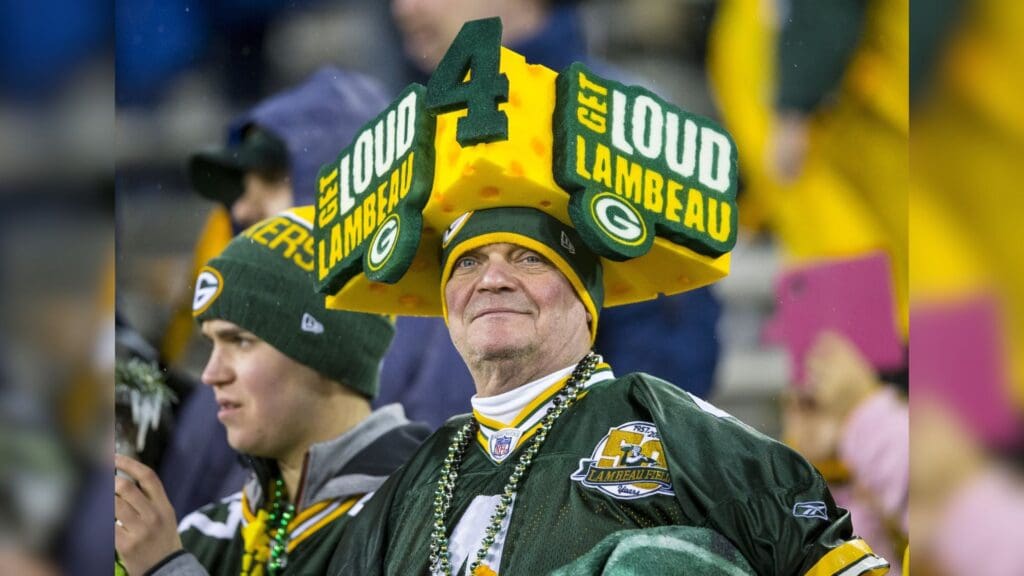 Nov 26, 2015; Green Bay, WI, USA; Green Bay Packers fans wear gear in support of Brett Favre during warmups prior to the NFL game against the Chicago Bears on Thanksgiving at Lambeau Field.