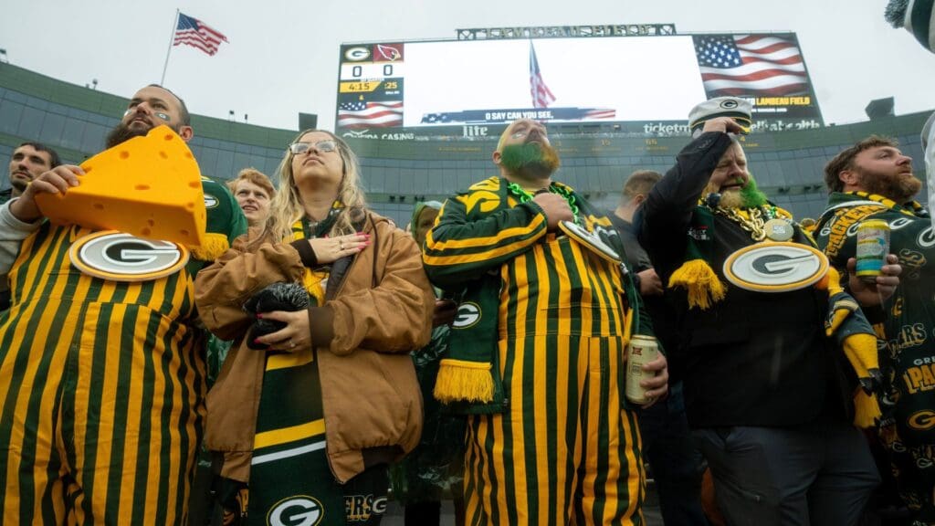 Fans stand for the National Anthem before the Green Bay Packers game against the Arizona Cardinals Sunday, October 13, 2024 at Lambeau Field in Green Bay, Wisconsin. The Green Bay Packers beat the Arizona Cardinals 34-13.