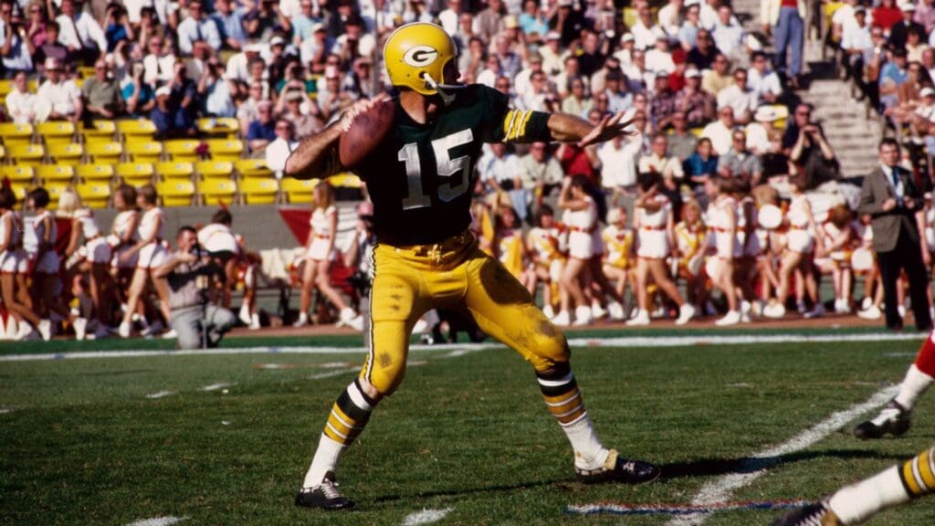 Jan 15, 1967; Los Angeles, CA, USA; FILE PHOTO; Green Bay Packers quarterback (15) Bart Starr in action against the Kansas City Chiefs during Super Bowl I at The Coliseum. The Packers defeated the Chiefs 35-10 to win the first meeting of the AFL versus the NFL for the world championshi
