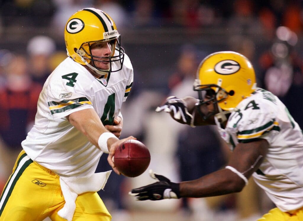 Dec 31, 2006; Chicago, IL, USA; Green Bay Packers quarterback (4) Brett Favre hands the ball off to running back (34) Vernand Morency during the 3rd quarter at Soldier Field in Chicago, IL. The Packers beat the Bears 26-7.