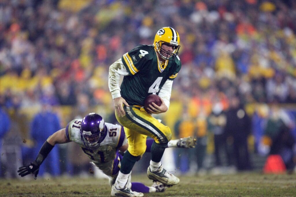 December 21, 2006; Green Bay, WI, USA; Green Bay Packers quarterback (4) Brett Favre scrambles out of the pocket as Minnesota Vikings linebacker (51) Ben Leber dives to try and make the sack at Lambeau Field.