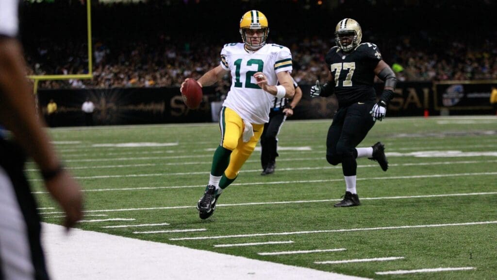 Green Bay Packers quarterback Aaron Rodgers runs for yardage against the New Orleans Saints on October 26, 2014, at the Mercedes-Benz Superdome in New Orleans, La. The Saints won 44-23.
