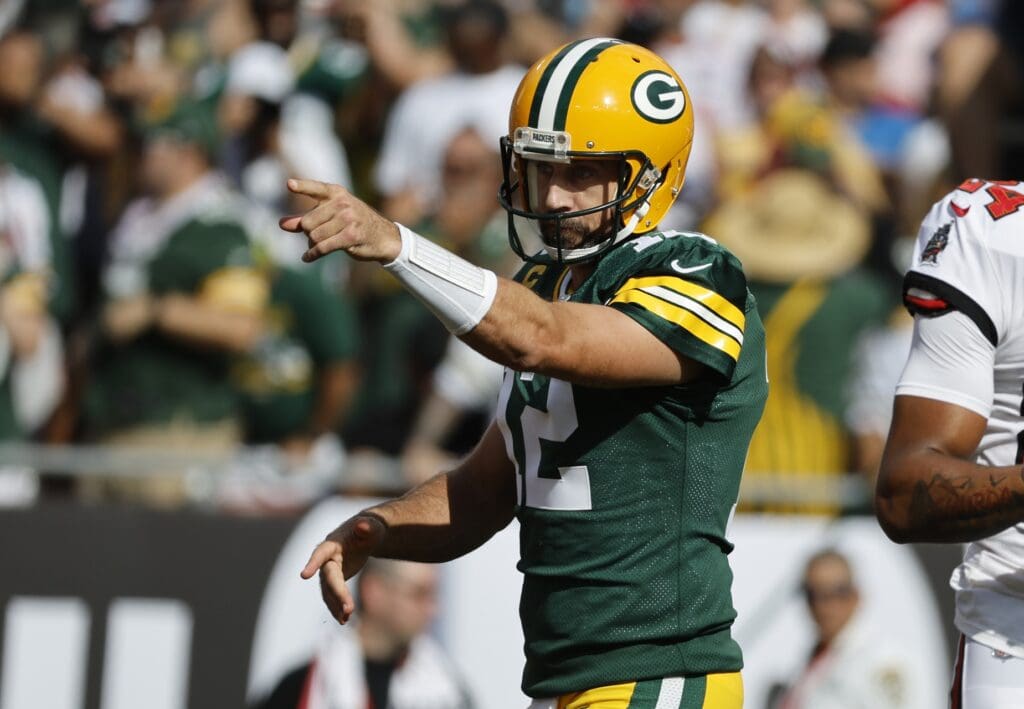 Sep 25, 2022; Tampa, Florida, USA; Green Bay Packers quarterback Aaron Rodgers (12) reacts on a touchdown scored against the Tampa Bay Buccaneers during the first quarter at Raymond James Stadium.