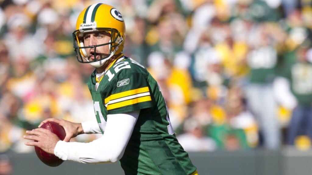 Sep 21, 2010; Green Bay, WI, USA; Green Bay Packers quarterback Aaron Rodgers (12) looks to throw a pass during the game against the Miami Dolphins at Lambeau Field. The Dolphins defeated the Packers 23-20.