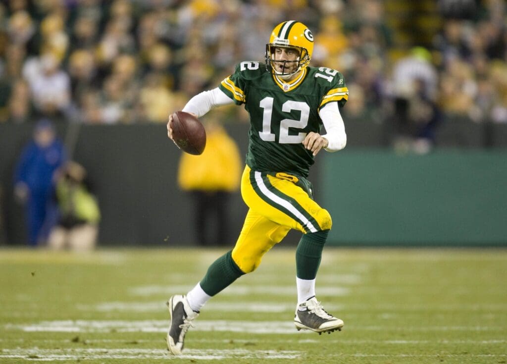 Nov 1, 2009; Green Bay, WI, USA; Green Bay Packers quarterback Aaron Rodgers (12) scrambles out of the pocket during the game against the Minnesota Vikings at Lambeau Field. The Vikings defeated the Packers 38-26.