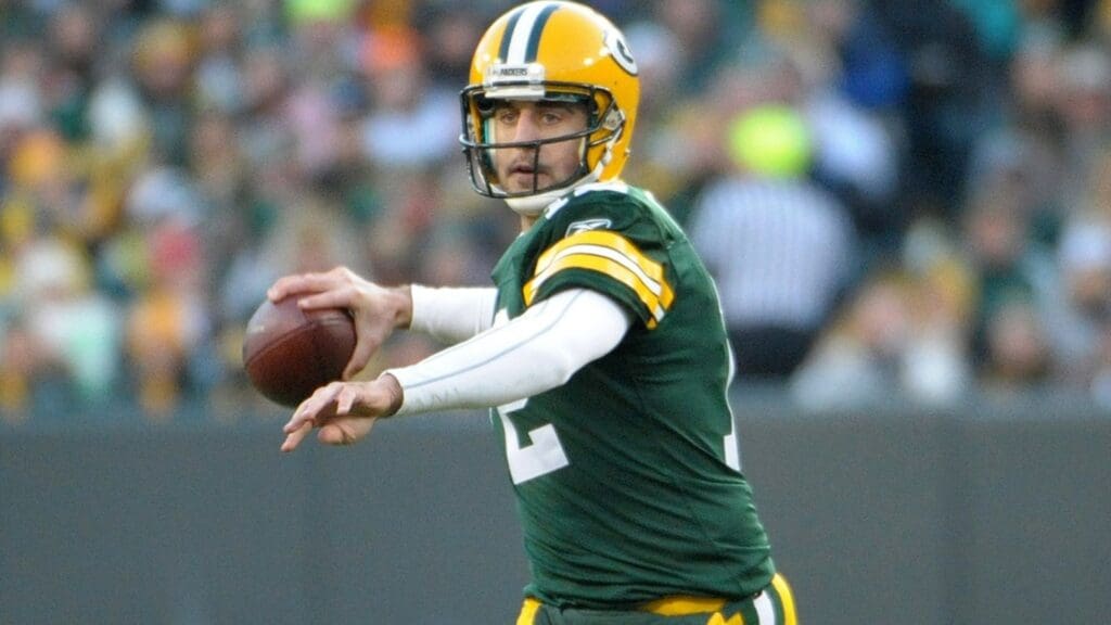 Dec 11, 2011; Green Bay, WI, USA; Green Bay Packers quarterback Aaron Rodgers (12) throws a pass against the Oakland Raiders at Lambeau Field.