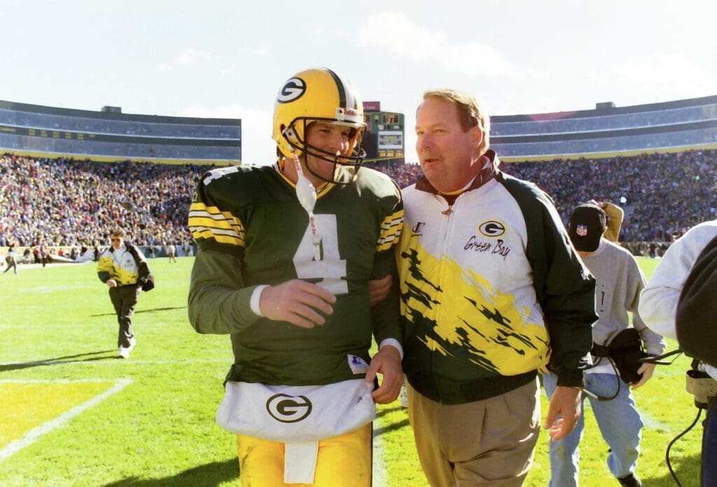 Green Bay Packers quarterback Brett Favre (4) and Green Bay Packers head coach Mike Holmgren walk off the field together after the victory of the Detroit Lions
