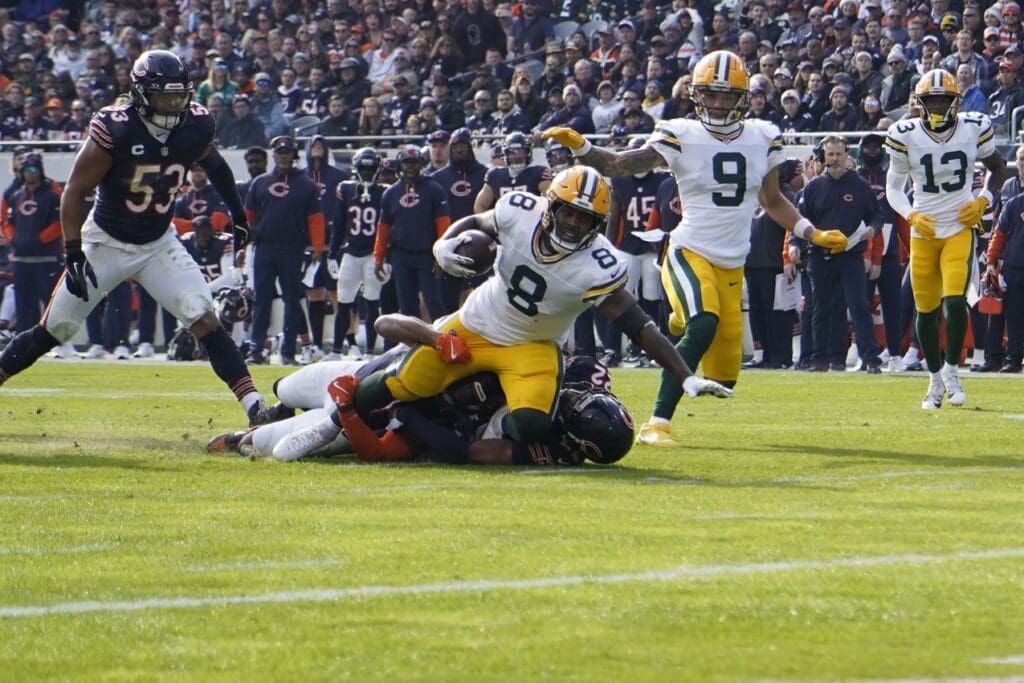 Nov 17, 2024; Chicago, Illinois, USA; Green Bay Packers running back Josh Jacobs (8) runs against the Chicago Bears during the first half at Soldier Field.