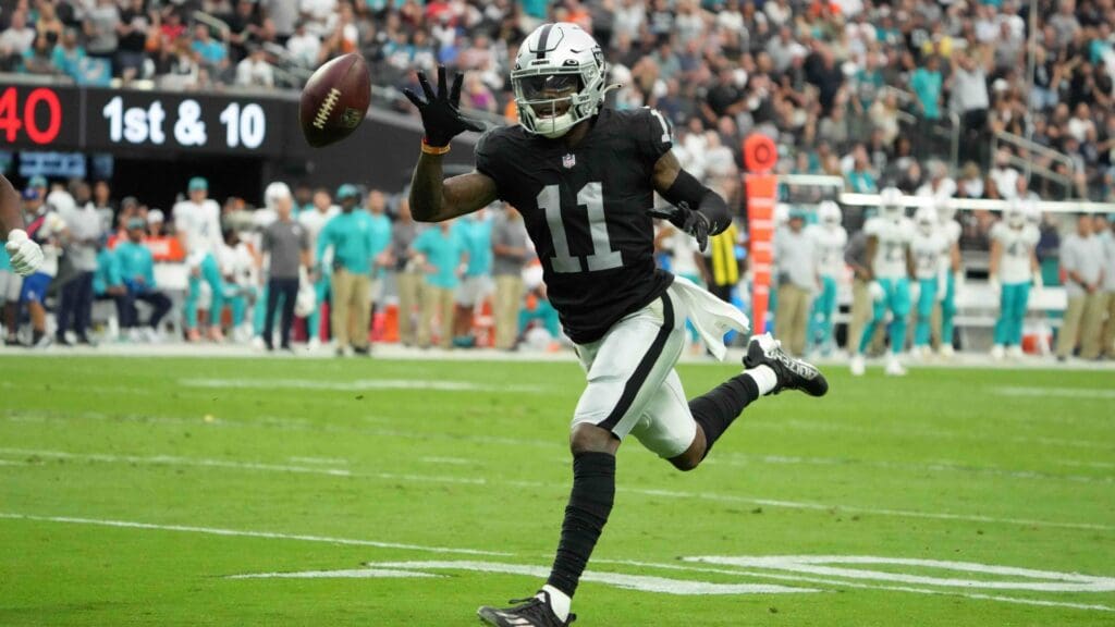 Sep 26, 2021; Paradise, Nevada, USA; Las Vegas Raiders wide receiver Henry Ruggs III (11) attempts to catch a pass in the second half against the Miami Dolphins at Allegiant Stadium.The Raiders defeated the Dolphins 31-28 in overtime.