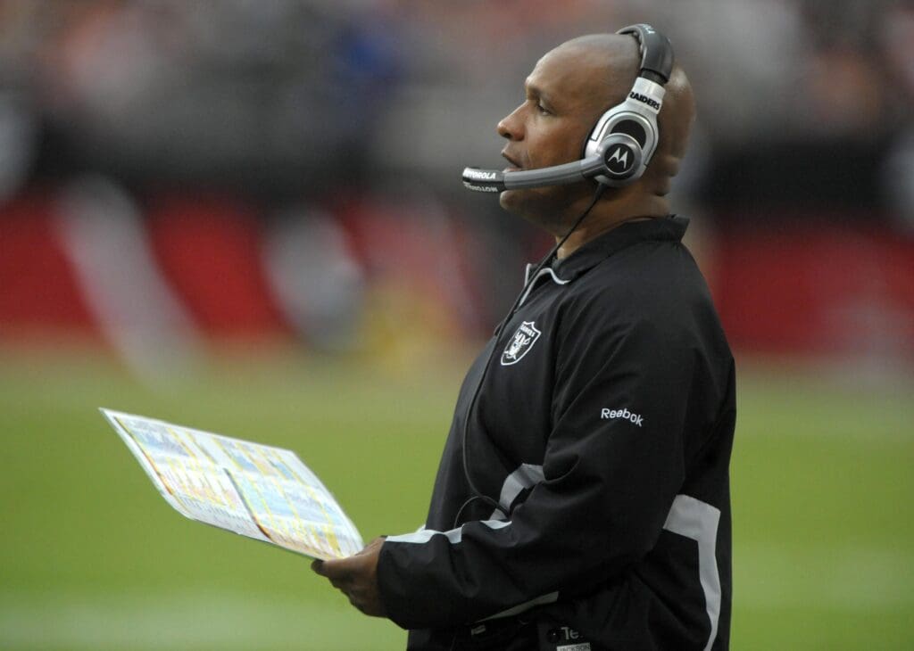 Sep 26, 2010; Glendale, AZ, USA; Oakland Raiders offensive coordinator Hue Jackson watches from the sidelines during the game against the Arizona Cardinals at the University of Phoenix Stadium.