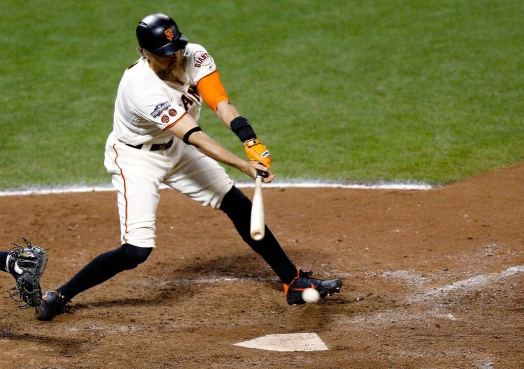 Oct 10, 2016; San Francisco, CA, USA; San Francisco Giants right fielder Hunter Pence (8) hits a single against the Chicago Cubs during the twelfth inning during game three of the 2016 NLDS playoff baseball series at AT&T Park.