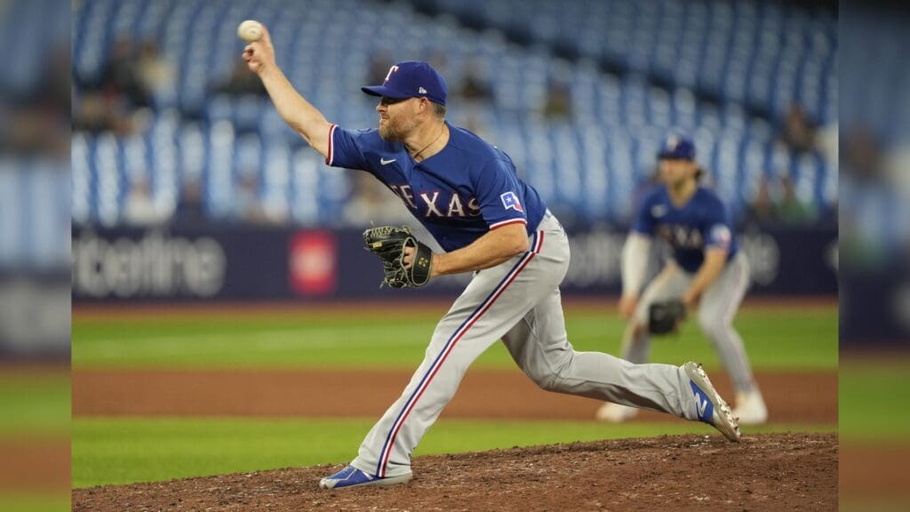 Sep 11, 2023; Toronto, Ontario, CAN; Texas Rangers pitcher Ian Kennedy (21) pitches to the Toronto Blue Jays during the ninth inning at Rogers Centre.