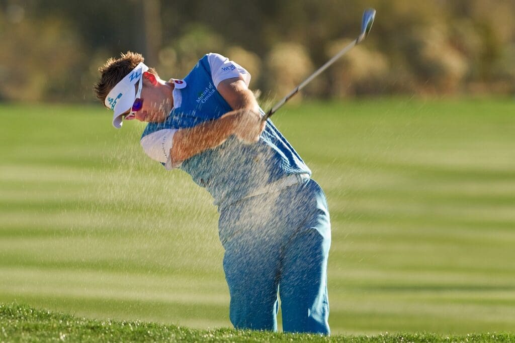 Feb 17, 2010; Marana, AZ, USA; Ian Poulter hits from the fairway bunker of the second hole during the first round of the Accenture Match Play Championship at the Ritz-Carlton Golf Club, Dove Mountain.