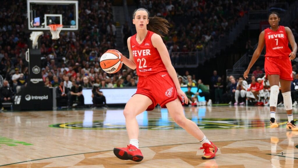 Jun 24, 2025; Seattle, Washington, USA; Indiana Fever guard Caitlin Clark (22) dribbles the ball against the Seattle Storm during the second half at Climate Pledge Arena.