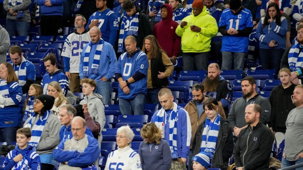 Indianapolis Colts fans stand during a moment of silence Sunday, Jan. 5, 2025, during a game against the Jacksonville Jaguars at Lucas Oil Stadium in Indianapolis.
