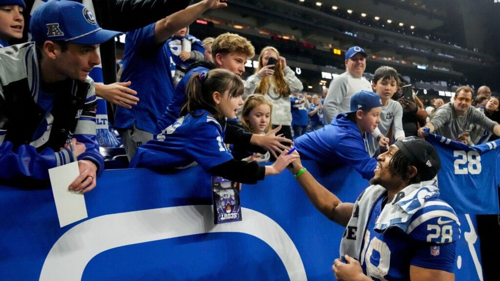 Indianapolis Colts running back Jonathan Taylor (28) greets fans Sunday, Jan. 5, 2025, after defeating the Jacksonville Jaguars 26-23 in overtime at Lucas Oil Stadium in Indianapolis.