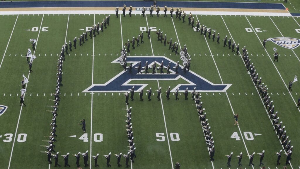 The University of Akron band takes the field before the game against OU on Friday, Nov. 24, 2023, in Akron, Ohio, at InfoCision Stadium