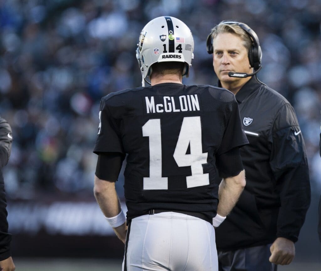 Dec 24, 2016; Oakland, CA, USA; Oakland Raiders quarterback Matt McGloin (14) speaks with head coach Jack Del Rio as a catch is reviewed against the Indianapolis Colts during the fourth quarter at the Oakland Coliseum. The Oakland Raiders defeated the Indianapolis Colts 33-25.