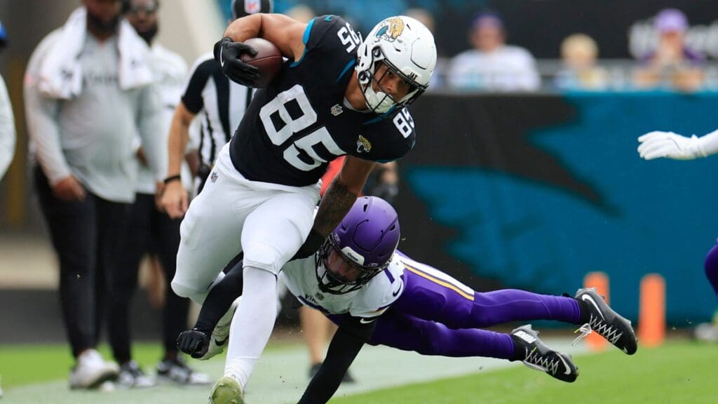 Jacksonville Jaguars tight end Brenton Strange (85) is pursued by Minnesota Vikings cornerback Byron Murphy Jr. (7) during the first quarter an NFL football matchup Sunday, Nov. 10, 2024 at Everbank Stadium in Jacksonville, Fla.
