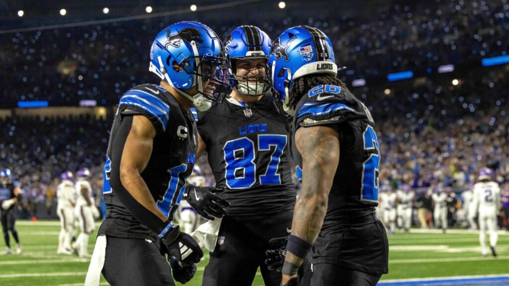 Jan 5, 2025; Detroit, Michigan, USA; Detroit Lions running back Jahmyr Gibbs (26) celebrates his touch down against the Minnesota Vikings with wide receiver Amon-Ra St. Brown (14) and tight end Sam LaPorta (87) during the second half at Ford Field.