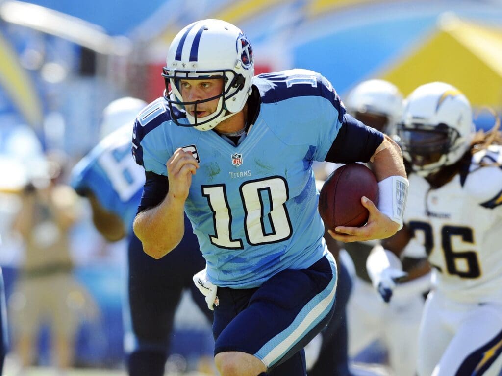 September 16, 2012; San Diego, CA, Tennessee Titans quarterback Jake Locker (10) runs for a first down during the second quarter against the San Diego Chargers at Qualcomm Stadium.