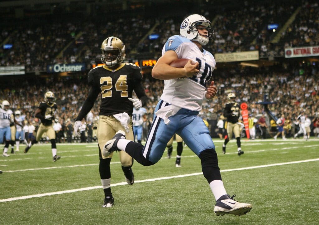 September 1, 2011; New Orleans, LA, USA; Tennessee Titans quarterback Jake Locker (10) runs into the endzone for a touchdown against the New Orleans Saints in the first quarter during a preseason game at the Louisiana Superdome.