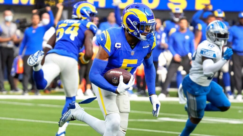 Oct 24, 2021; Inglewood, California, USA; Los Angeles Rams cornerback Jalen Ramsey (5) runs back an interception in the fourth quarter against the Detroit Lions at SoFi Stadium.