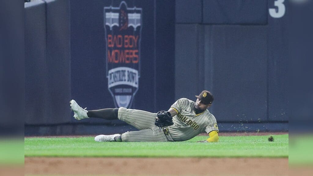 May 6, 2025; Bronx, New York, USA; San Diego Padres left fielder Jason Heyward (22) makes a diving catch in the third inning against the New York Yankees at Yankee Stadium.