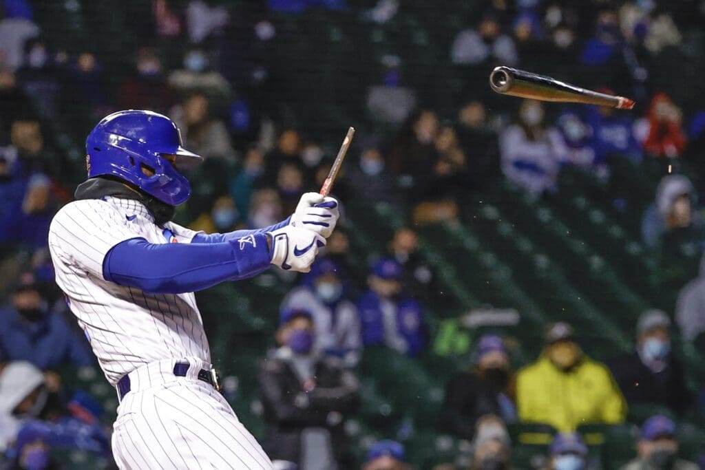 May 5, 2021; Chicago, Illinois, USA; Chicago Cubs right fielder Jason Heyward (22) breaks his bat on a pitch off of Los Angeles Dodgers starting pitcher Walker Buehler (21) during the sixth inning at Wrigley Field.