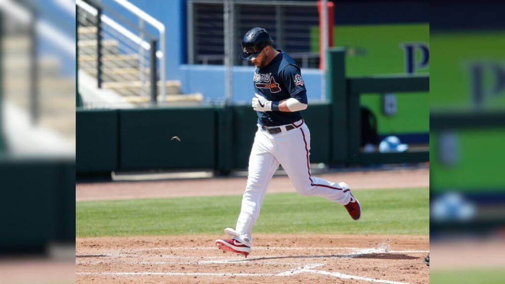 Mar 14, 2021; North Port, Florida, USA; Atlanta Braves designated hitter Jason Kipnis (22) steps on home after hittiing a home run against the Tampa Bay Rays in the fifth inning during spring training at CoolToday Park.