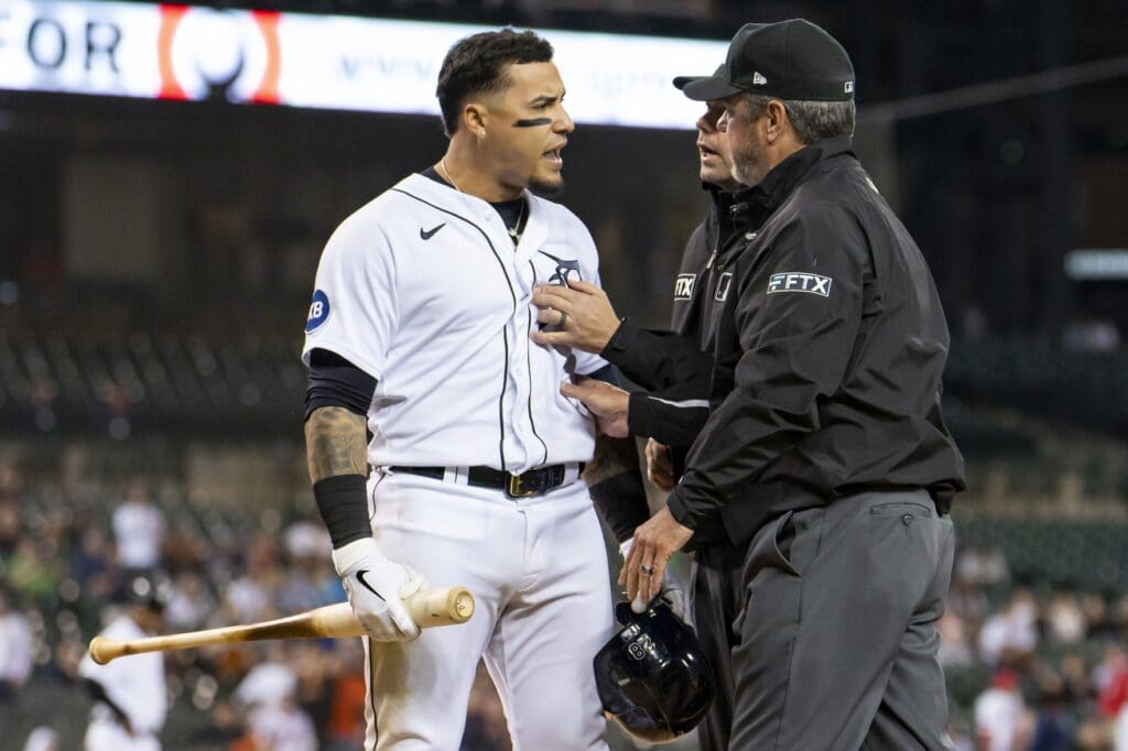 May 9, 2022; Detroit, Michigan, USA; Detroit Tigers shortstop Javier Baez (28) has to get held back by two umpires after being ejected from the game during the ninth inning against the Oakland Athletics at Comerica Park.