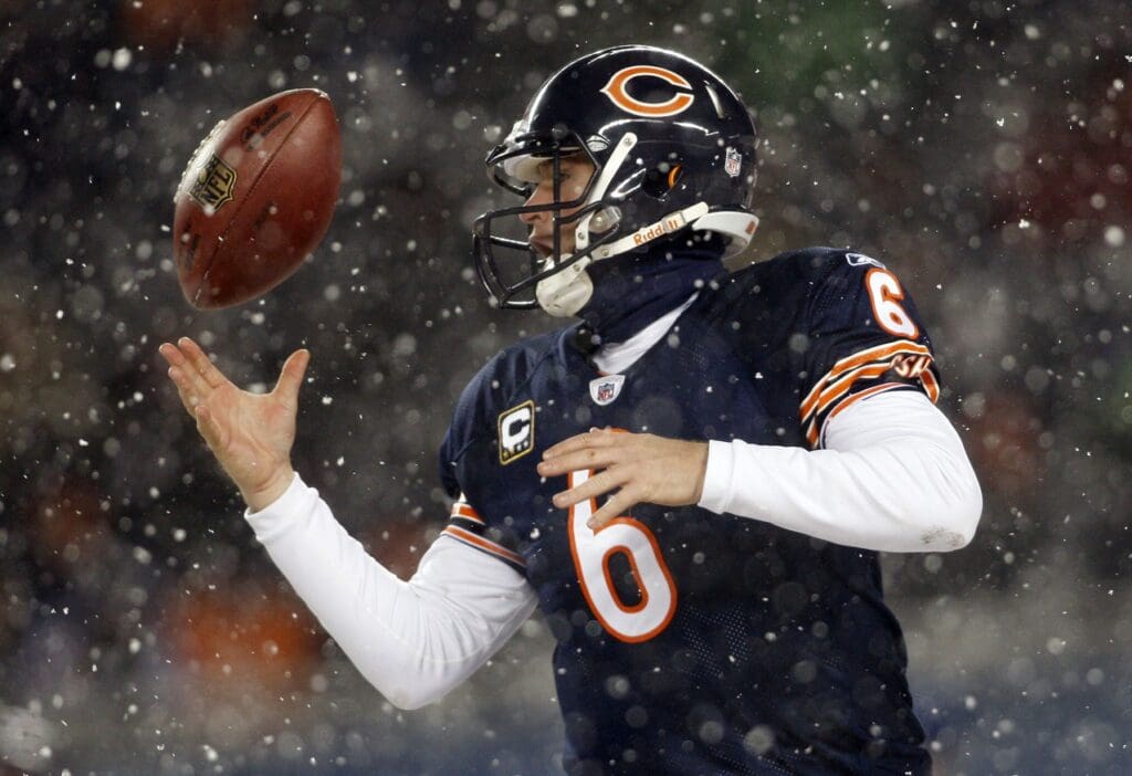 Dec 12, 2010; Chicago, IL, USA; Chicago Bears quarterback Jay Cutler (6) bobbles a snap during the fourth quarter against the New England Patriots at Soldier Field. The Patriots won 36-7.