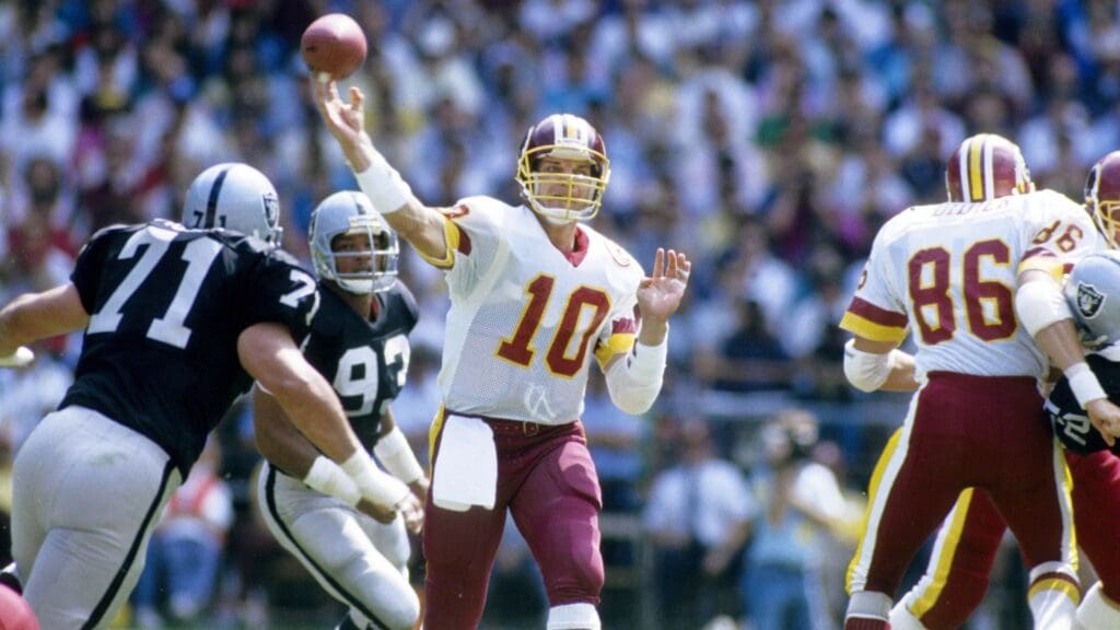 Washington Redskins quarterback Jay Schroeder (10) in action against the Los Angeles Raiders at RFK Stadium.
