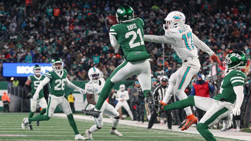 Jan 5, 2025; East Rutherford, New Jersey, USA; New York Jets safety Ashtyn Davis (21) intercepts a pass intended for Miami Dolphins wide receiver Jaylen Waddle (17) during the first half at MetLife Stadium.