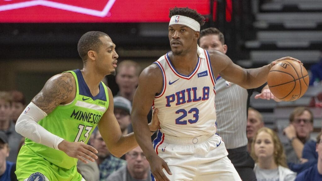 Mar 30, 2019; Minneapolis, MN, USA; (Philadelphia 76ers guard Jimmy Butler (23) backs towards the basket as Minnesota Timberwolves guard Cameron Reynolds (13) plays defense in the second half at Target Center