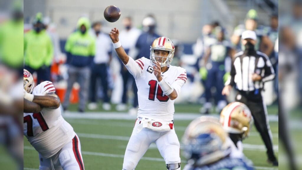 Nov 1, 2020; Seattle, Washington, USA; San Francisco 49ers quarterback Jimmy Garoppolo (10) passes against the Seattle Seahawks during the second quarter at CenturyLink Field.