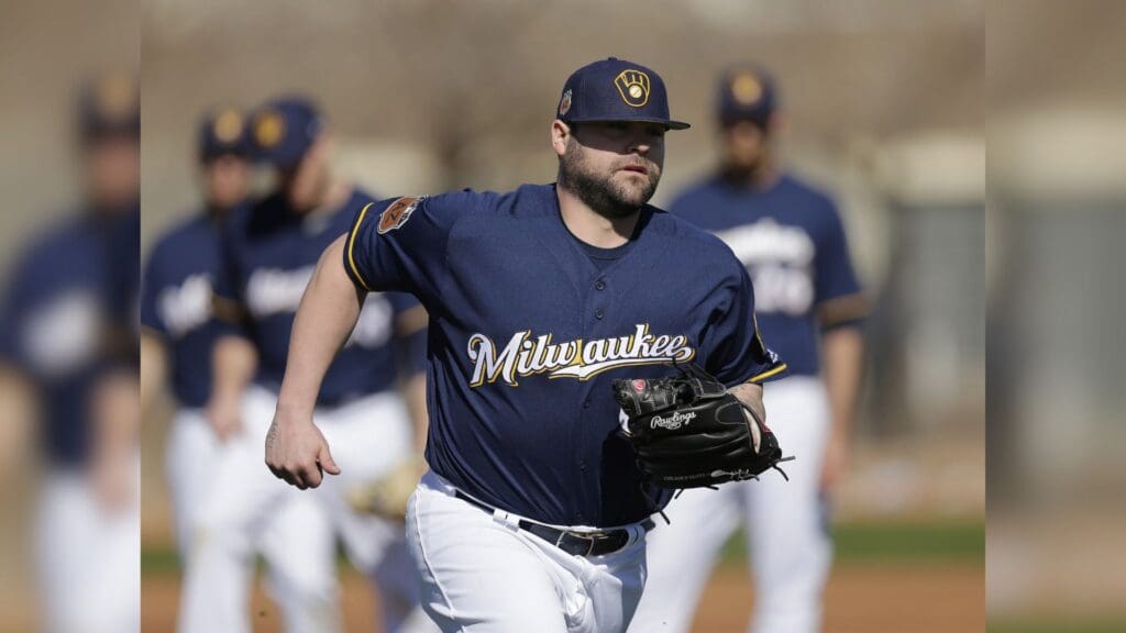 Feb 16, 2017; Maryvale, AZ, USA; Milwaukee Brewers relief pitcher Joba Chamberlain (62) covers first base during spring training camp drills at Maryvale Baseball Park.