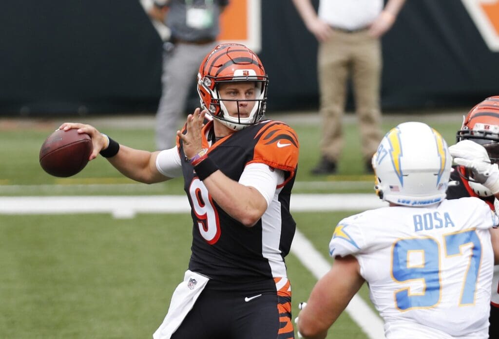Sep 13, 2020; Cincinnati, Ohio, USA; Cincinnati Bengals quarterback Joe Burrow (9) looks to throw a pass against the Los Angeles Chargers during the first half at Paul Brown Stadium.