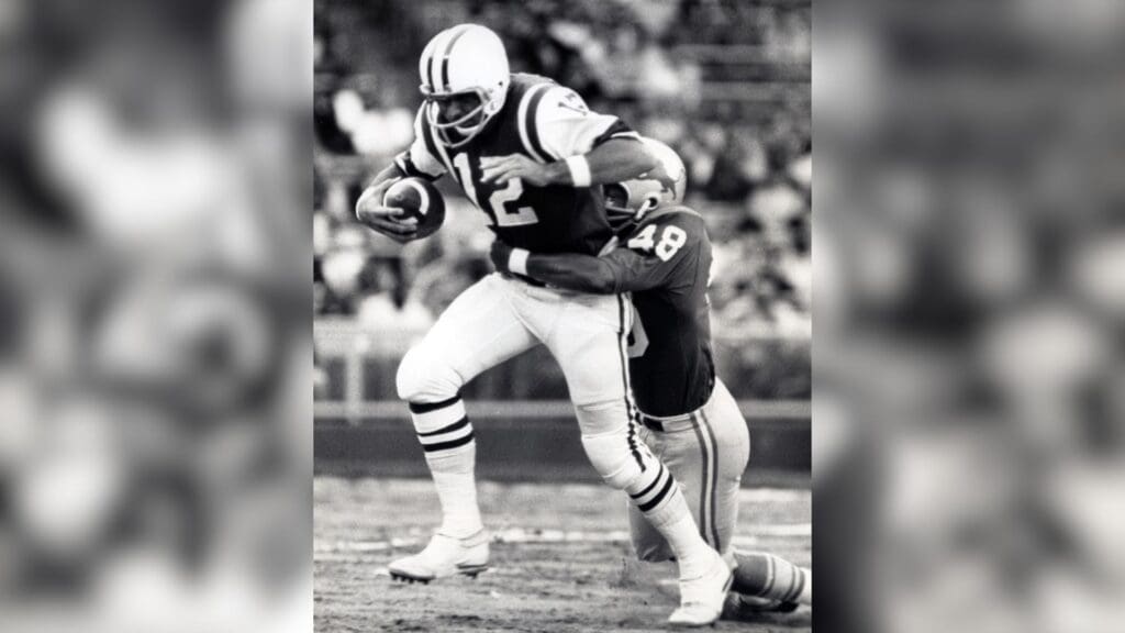 Sep 7, 1968: Cleveland, OH USA; FILE PHOTO; New York Jets quarterback Joe Namath (12) is tackled by Detroit Lions safety Tom Vaughn (48) during the 1968 pre-season at Cleveland Stadium.