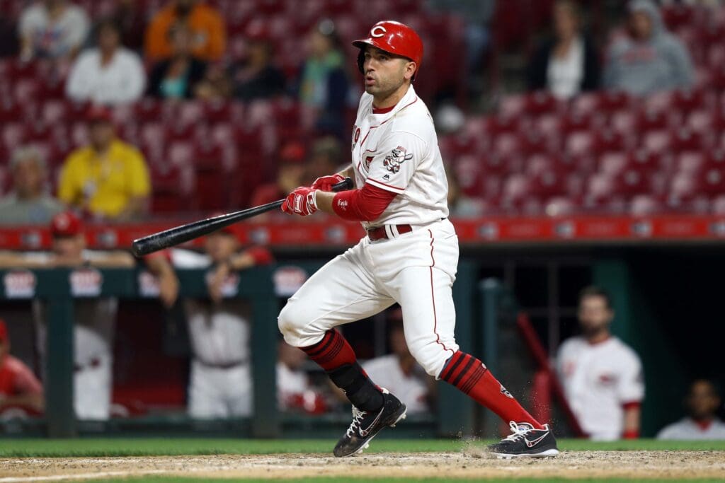 Jun 5, 2018; Cincinnati, OH, USA; Cincinnati Reds first baseman Joey Votto (19) singles on a hit against the Colorado Rockies in the ninth inning at Great American Ball Park.