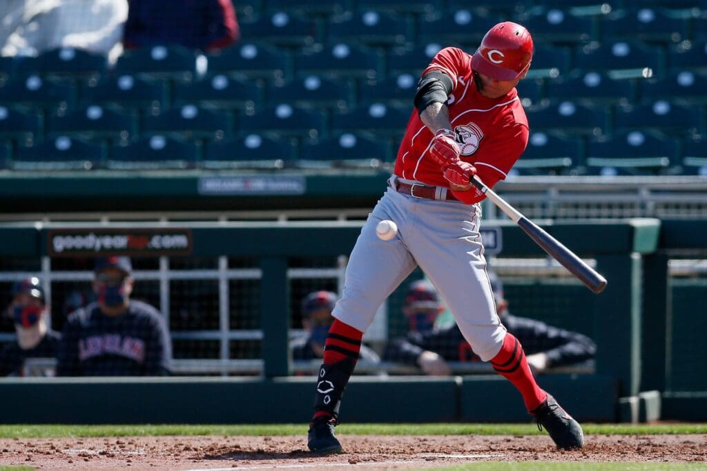 Cincinnati Reds first baseman Joey Votto (19) singles to left field in the third inning of the MLB Cactus League Spring training game between the Cincinnati Reds and Cleveland at Goodyear Ballpark in Goodyear, Ariz., on Sunday, Feb. 28, 2021. Cincinnati Reds At Cleveland Spring Training