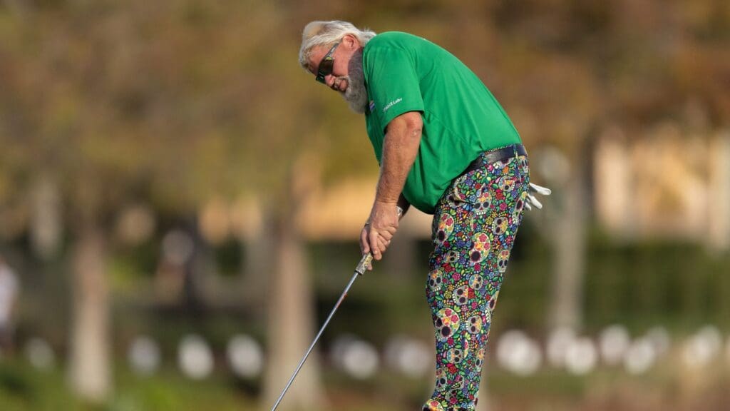 Dec 19, 2021; Orlando, Florida, USA; John Daly putts on the 18th green during the final round of the PNC Championship golf tournament at Grande Lakes Orlando Course