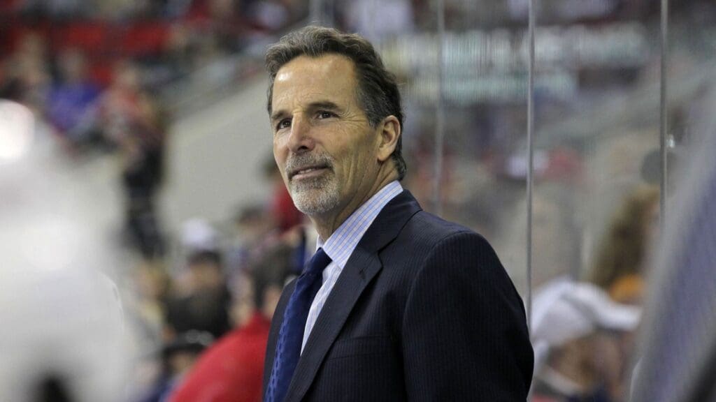 March 1, 2012; Raleigh, NC, USA; New York Rangers coach John Tortorella smiles during the game against the Carolina Hurricanes at the RBC center. The Rangers defeated the Hurricanes, 3-2.